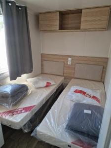 Giường trong phòng chung tại L'Amira 3ch, 2 SDB, 40m2, Confort et détente