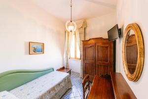 Кровать или кровати в номере Hotel Toro