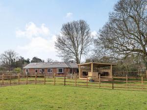 a farm house with a pavilion in a field at 4 Bed in Manby 87031 in Manby