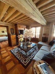 a living room with a couch and a table at Le Saint Joseph in Courchevel