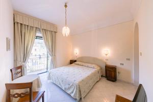 Кровать или кровати в номере Hotel Toro