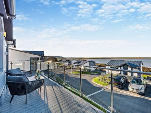 a balcony with a view of a parking lot at 4 Bed in Appledore 92017 in Appledore