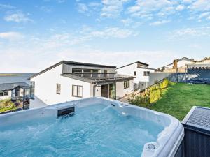 a hot tub on the balcony of a house at 4 Bed in Appledore 92017 in Appledore