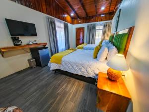 Ένα ή περισσότερα κρεβάτια σε δωμάτιο στο Sibu Boutique Hotel