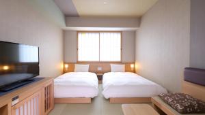 Posteľ alebo postele v izbe v ubytovaní Onyado Nono Asakusa Bettei Hot Spring