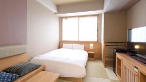 Posteľ alebo postele v izbe v ubytovaní Onyado Nono Asakusa Bettei Hot Spring