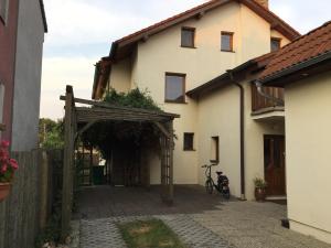 a house with a bike parked in front of it at Pension 325 in Tábor