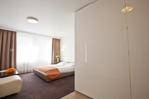מיטה או מיטות בחדר ב-Platinum Apartments Aparthotel