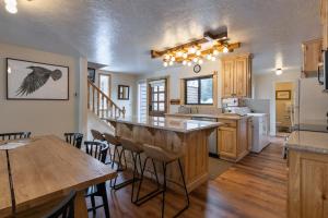 a kitchen with a bar and a dining room at Wister A in Jackson