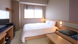 Posteľ alebo postele v izbe v ubytovaní Onyado Nono Asakusa Bettei Hot Spring