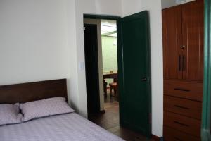 Ένα ή περισσότερα κρεβάτια σε δωμάτιο στο Casa Mostaza Pueblito Boyacense +37 φωτογραφίες