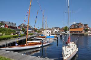 a group of boats docked in a harbor at Ort Lemkenhafen Bolle in Fehmarn