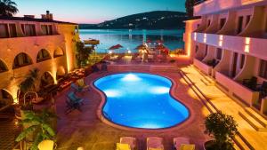 an overhead view of a swimming pool in a building at Oscar Seaside Hotel & Spa in Bodrum City