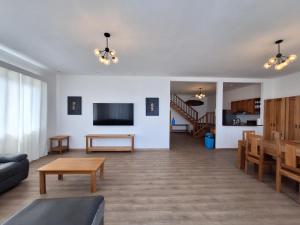 a living room with a couch and a table at Paunch Beach Retreat in Bocas del Toro