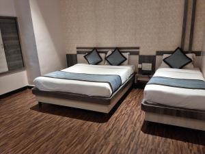 Postel nebo postele na pokoji v ubytování Hotel Kiara Eshosans Palace