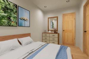 a bedroom with a bed and a dresser and a mirror at Squam Lake 3 bed plus 3 bath rental (Suite 7) in Holderness