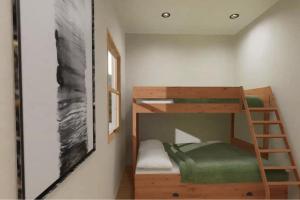a bunk bed in a small room with a ladder at Squam Lake 3 bed plus 3 bath rental (Suite 7) in Holderness