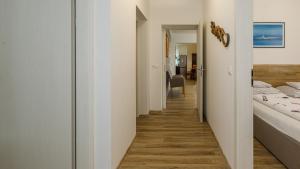 Postel nebo postele na pokoji v ubytování Kendosz Apartman