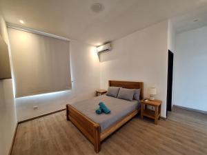 Una cama o camas en una habitación de Paunch Beach Retreat