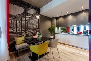 a dining room and kitchen with a table and chairs at Onyx Luxury Budapest in Budapest