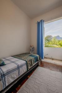 เตียงในห้องที่ 2 quartos em Ipanema com vista para Lagoa e Cristo