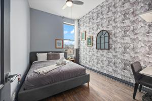 a bedroom with a bed and a wall at McCormick Place Guest House in Chicago