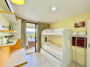 a small room with bunk beds and a balcony at Wai Wai Cumbuco Resort in Cumbuco +83 photos