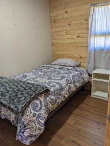 Postel nebo postele na pokoji v ubytování Cabaña Coigües Balneario Punta de Lapas