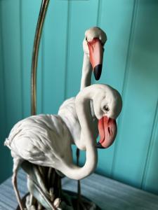 a statue of a bird with its beaks out at Georgian Russell in Hastings