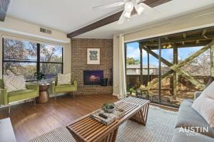 a living room with a couch and a fireplace at Walk to Zilker Patio w a View Elevated Balcony in Austin