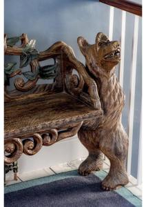 a statue of a bear standing next to a table at House in Hastings in Hastings