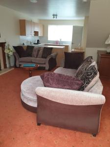 a living room with a couch and a chair at The Annexe in Bridlington