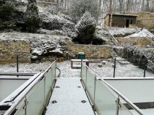 a walkway with snow on the ground and a fence at Penthouse 3 bedrooms in center w. private garden in Luxembourg