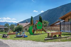 a park with a playground with a slide at Mesnerhof in Valles