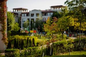 a view of a park with buildings in the background at Smokinia Sunrise - Kavatsi Beach, Sozopol in Sozopol