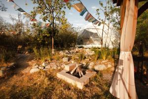 a garden with a fire pit in the yard at CastaVerde in Palomas
