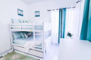 Postel nebo postele na pokoji v ubytování Atlantis Luxury Villages - Neptun