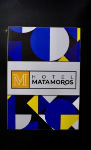 two signs with the words mato marmoros on them at Hotel Matamoros in Tepatitlán de Morelos