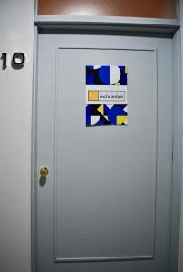 a white door with a sign on it at Hotel Matamoros in Tepatitlán de Morelos