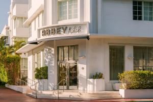 a facade of a building with a bakery shop at Sonder The Abbey in Miami Beach