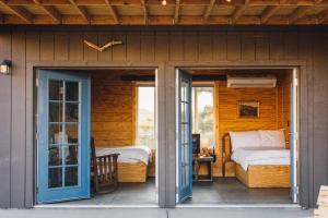 A bed or beds in a room at Joshua Tree Hidden Tower * Views - Landmark