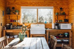 A kitchen or kitchenette at Joshua Tree Hidden Tower * Views - Landmark