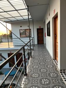 a hallway of a building with a tile floor at vila djonasse in Matola