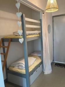 a bunk bed with two bunk beds in a room at DINAPARK in Dinard