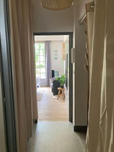 a hallway leading to a room with a living room at DINAPARK in Dinard