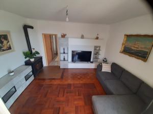 a living room with a couch and a flat screen tv at Franceska in Korčula