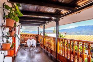 a balcony with a table and a view of mountains at Colonial Home Chachapoyas in Chachapoyas