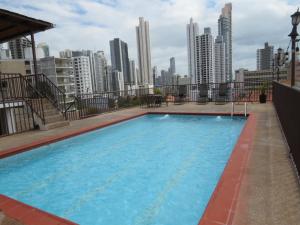 a large swimming pool on the roof of a building at Hotel Costa Inn in Panama City