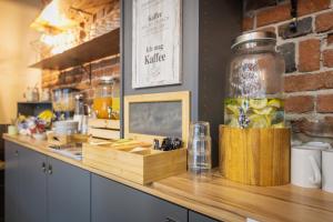 a counter in a restaurant with a jar on it at Cityapartment Wagner mit Netlix in Bielefeld