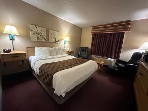 Posteľ alebo postele v izbe v ubytovaní De Smet Super Deluxe Inn & suites